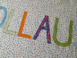 Preview: Namenskissen bunte Tupfen 40x65
