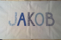 Preview: Namenskissen Jakob weiß mit blauen Pünktchen 40x65