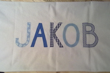 Preview: Namenskissen Jakob weiß mit blauen Pünktchen 40x65