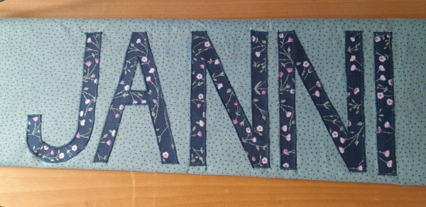 Namenskissen Janni Minipunkte blaugrün 40x80
